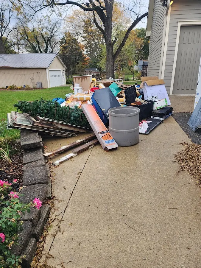 Dumpster being loaded with debris for Roofing Dumpster Rental in Chestertown